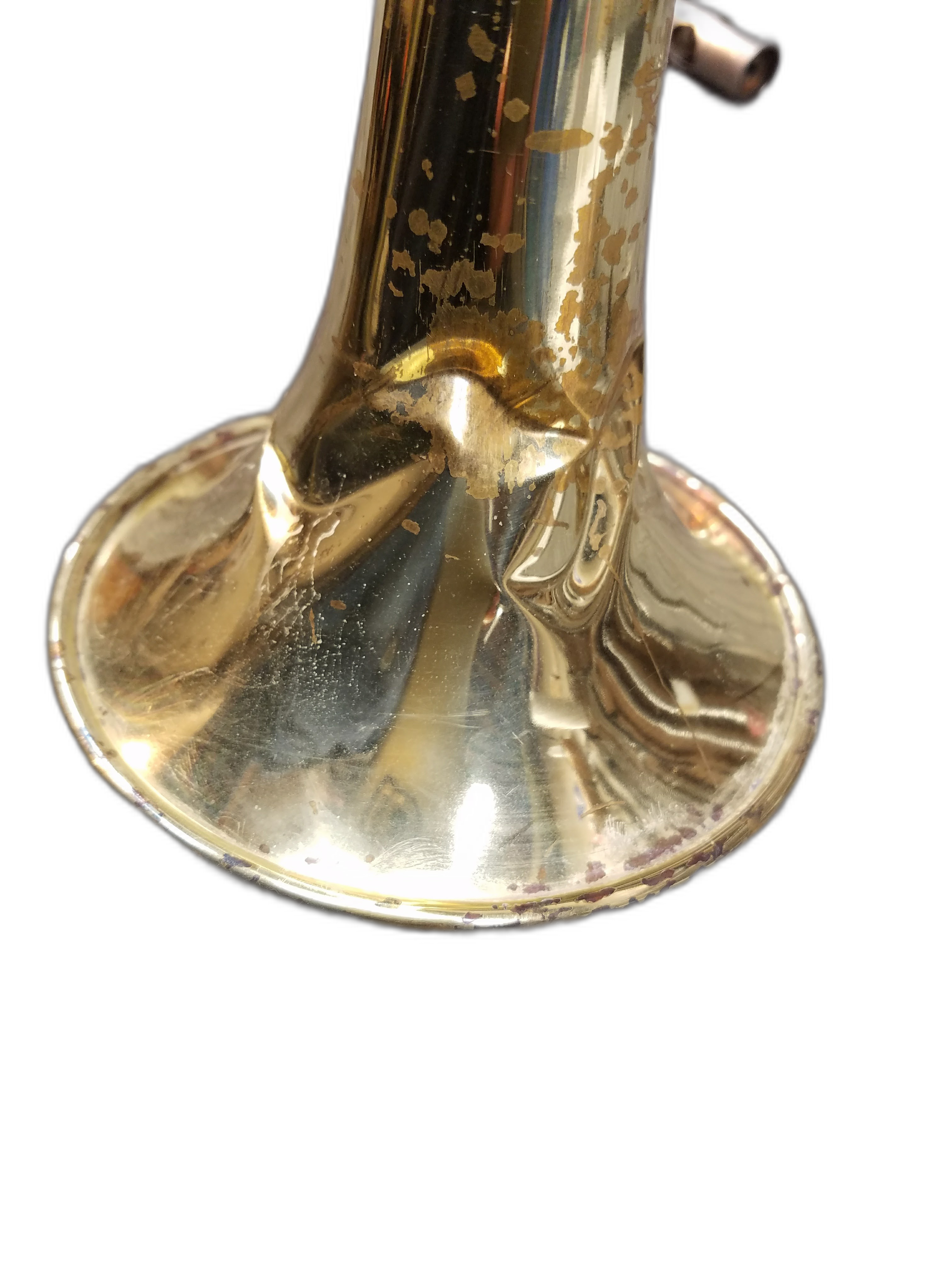 Trumpet bell with heavy dent damage