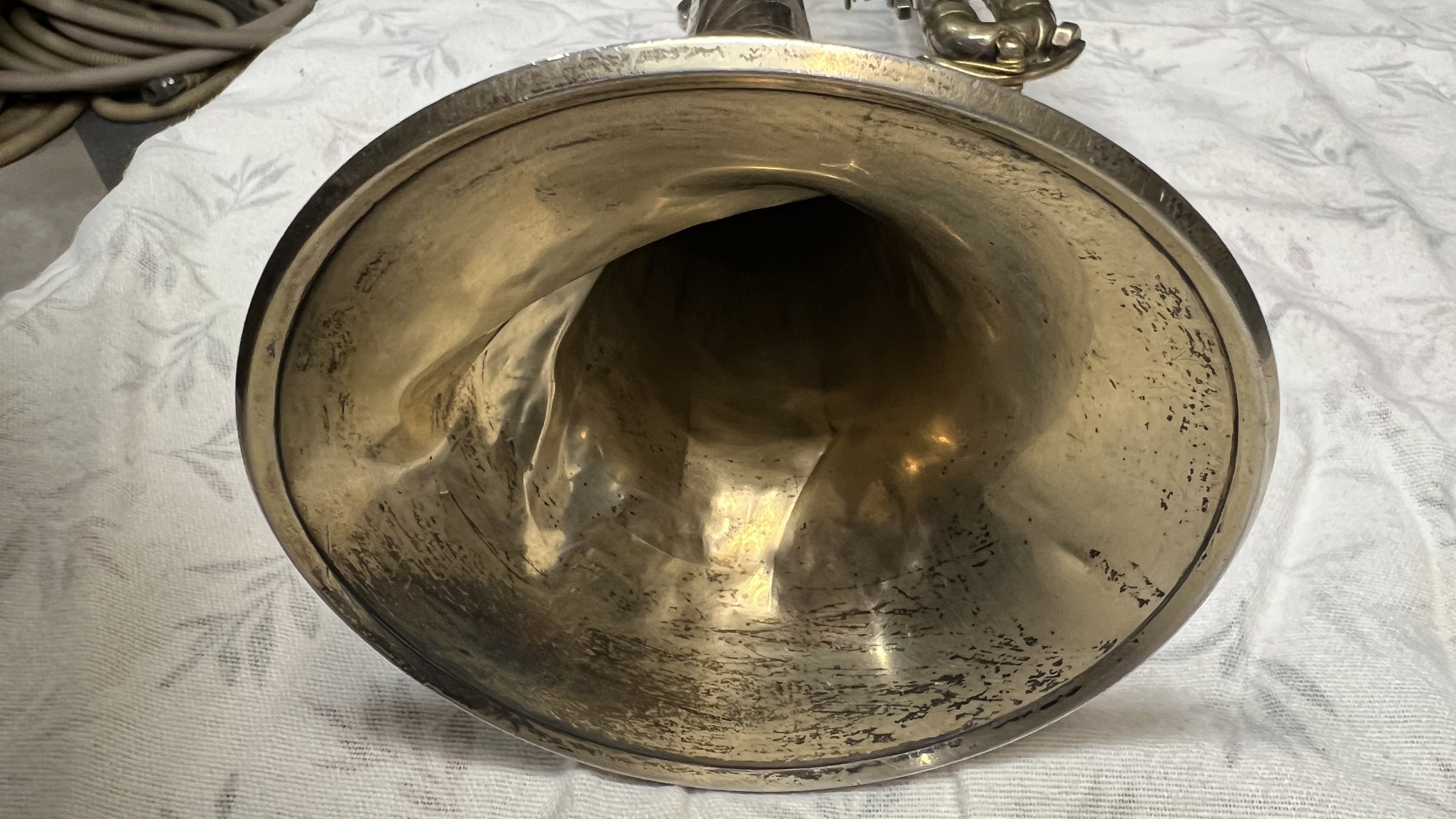 Inside the bell before restoration, crumpled deep into the throat